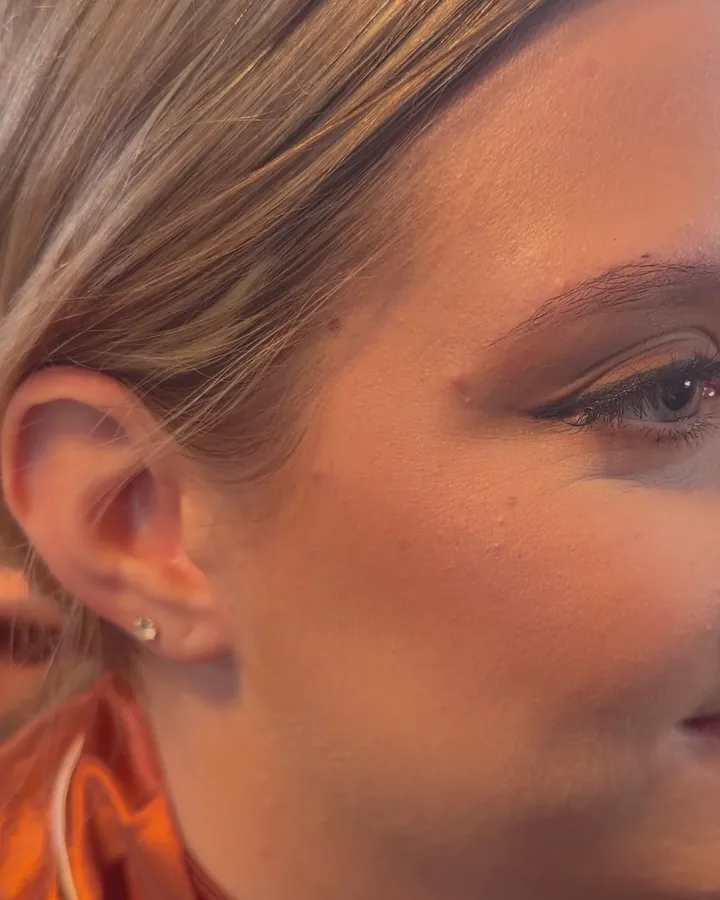 Close-up of eye and temple: blended warm shadow into the crease.