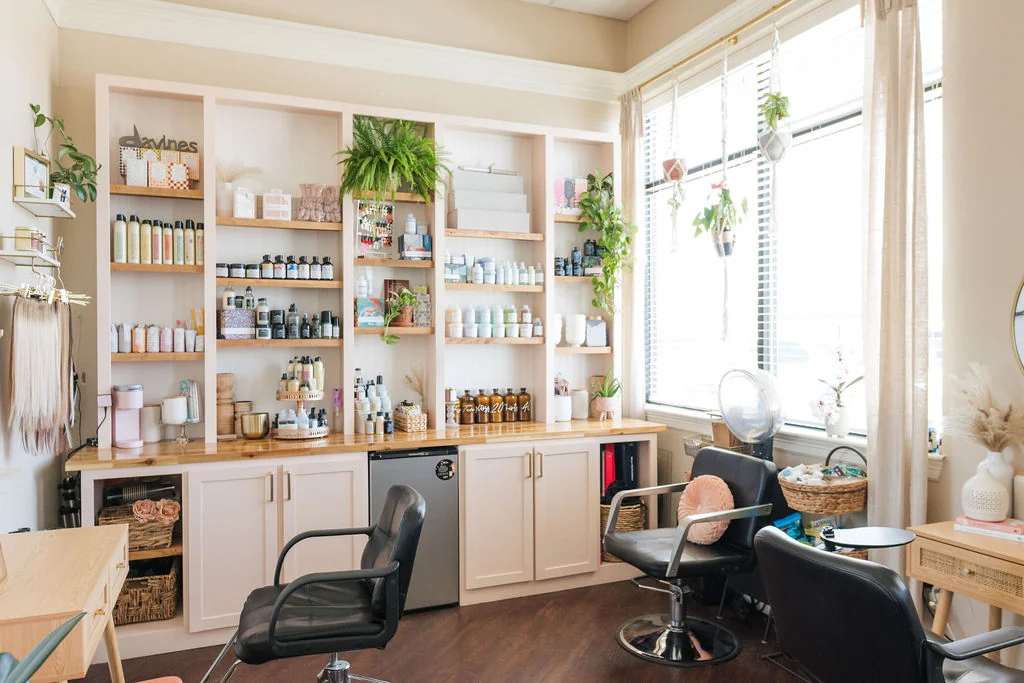 Styling stations and product shelves at Fringe Hair Studio