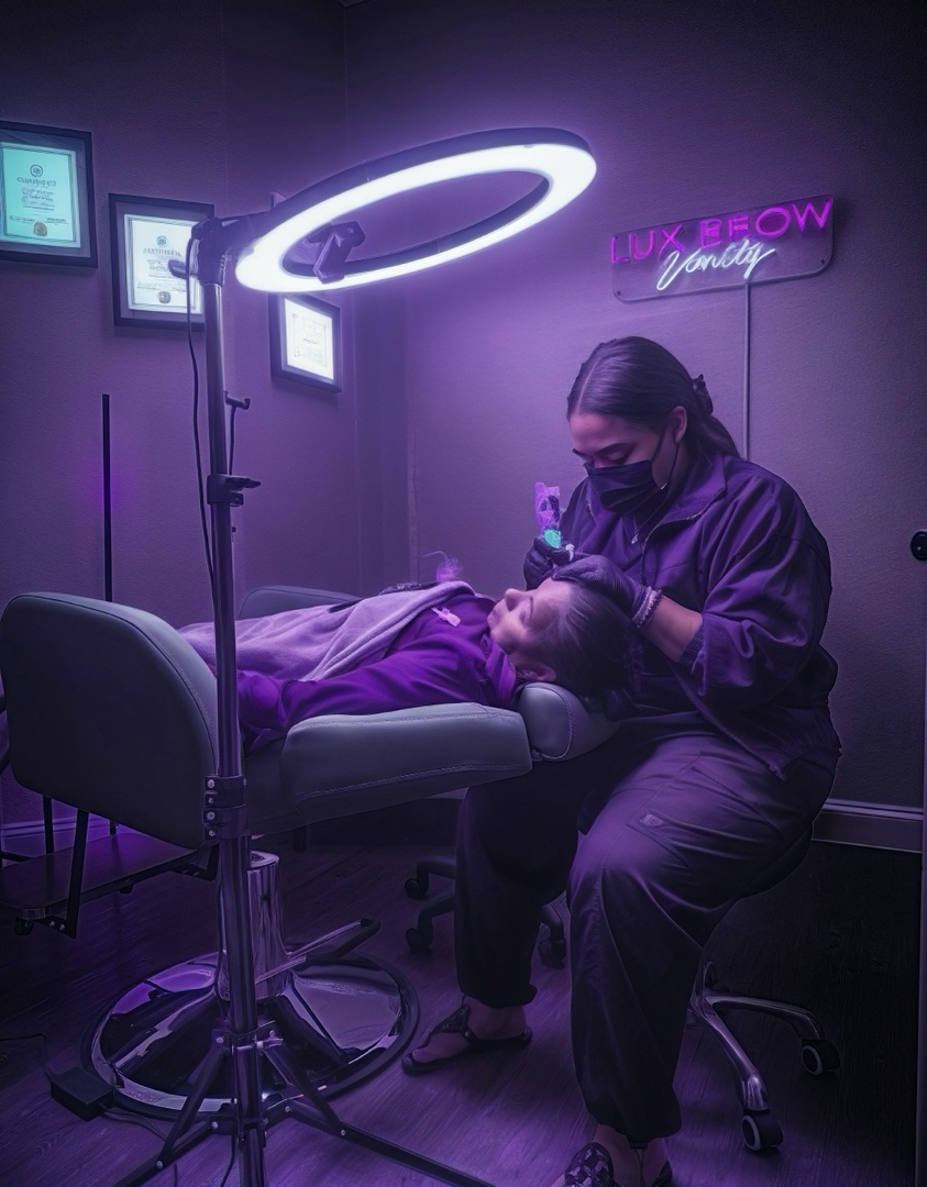 Bianka Ortiz working with a client in her Lux Brow Vanity suite.