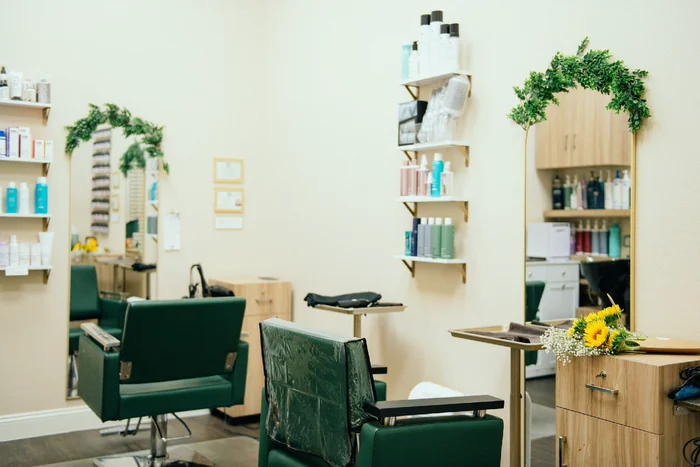 New Image by Dani’s green-accented salon suite.