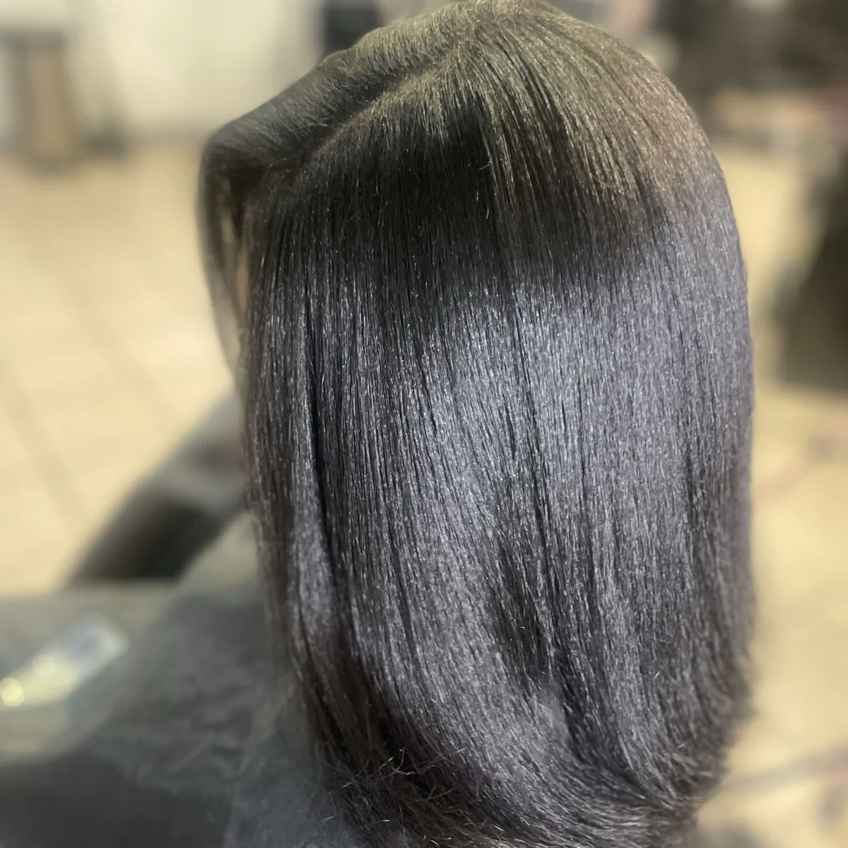 Straight, glossy black hair falling past the shoulders, from Miss B’s Booksy page