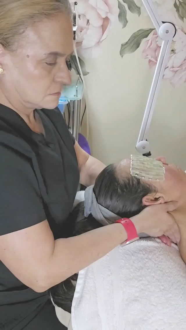 A client during a facial treatment, from Divinity Spa’s Instagram