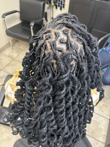 Sculpted loc styling from Swanika’s portfolio